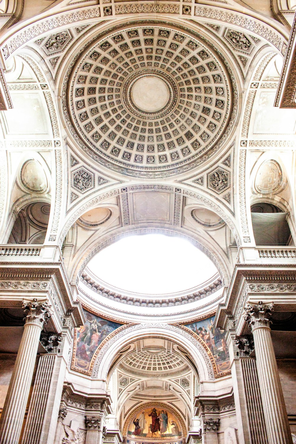 the ceiling of a large building with a dome