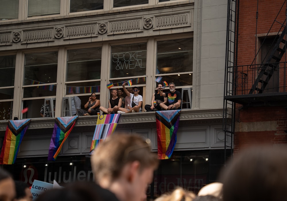 a group of people standing on top of a building