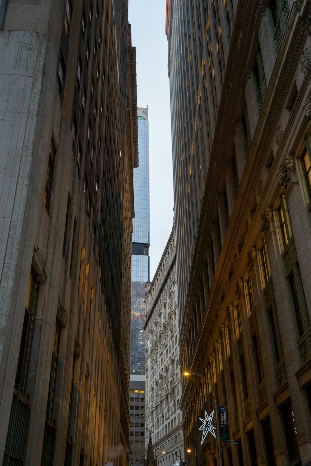 a city street filled with tall buildings next to tall buildings