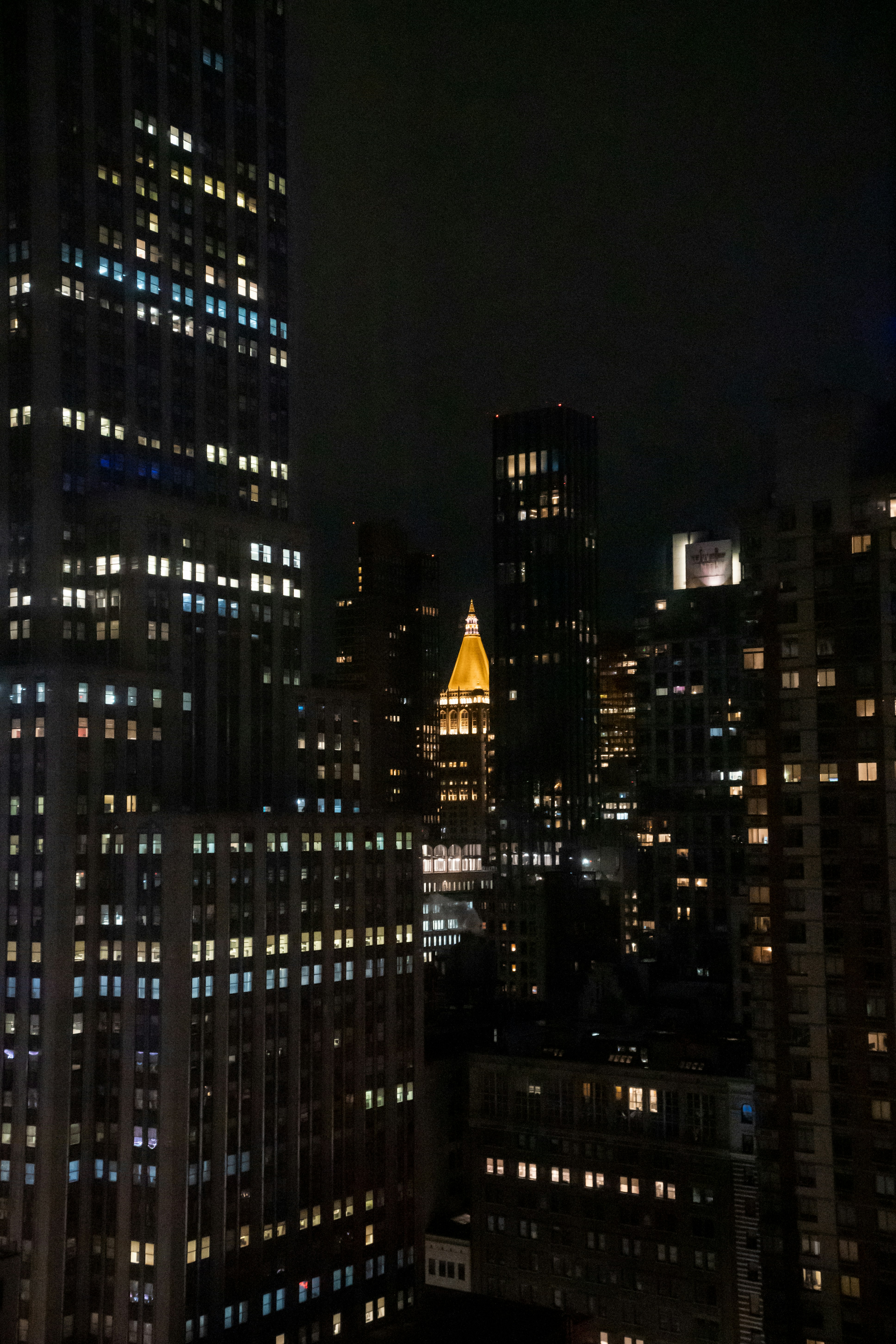 a view of a city at night from the top of a building