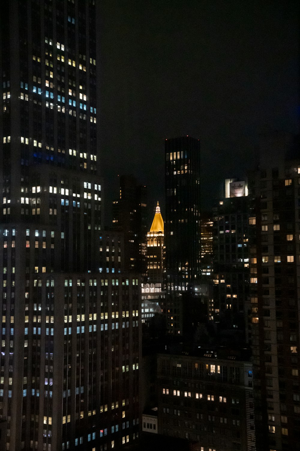 a view of a city at night from the top of a building