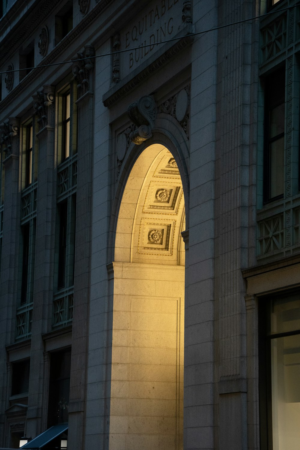 a clock on the side of a building at night