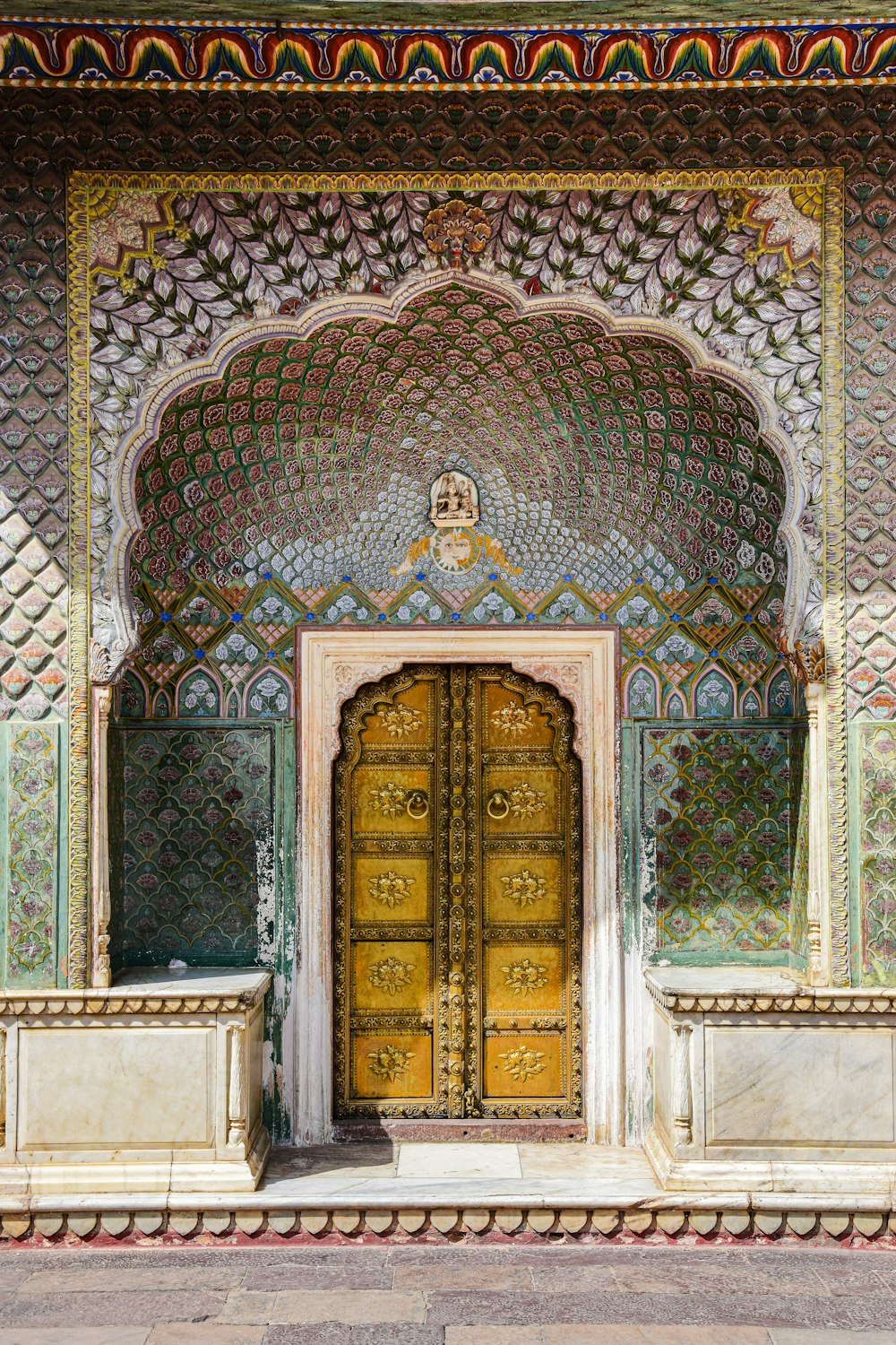 an ornate building with a large wooden door