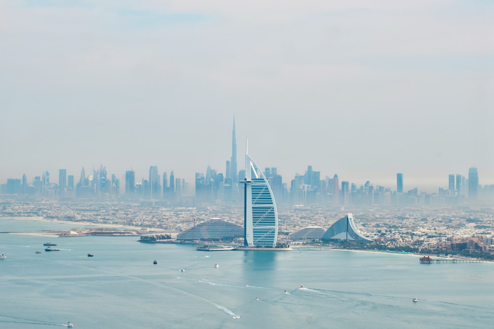 a large body of water with a city in the background