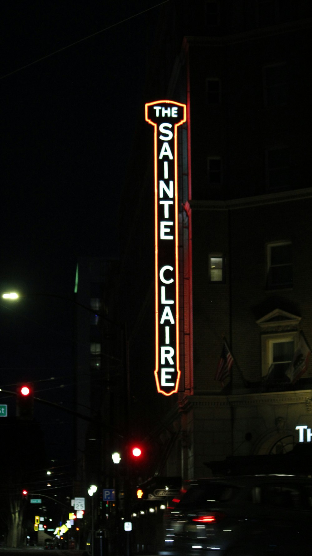 a large neon sign on the side of a building