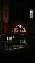 Cozy diner entrance with warm lighting and a welcoming sign at dusk.