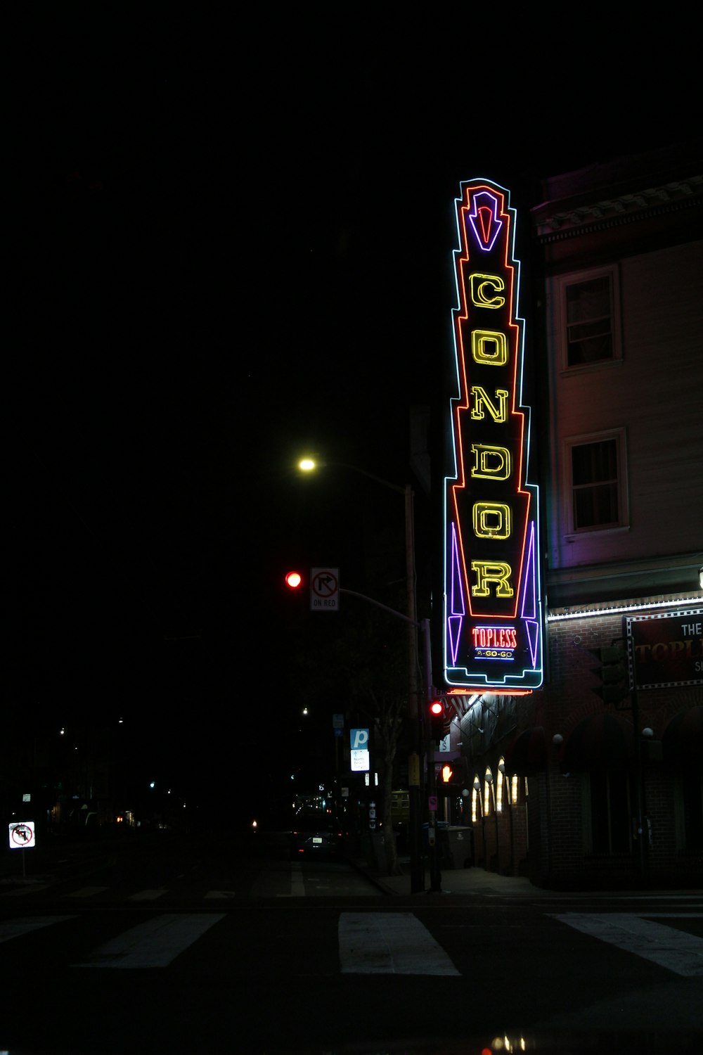 a neon sign on the side of a building