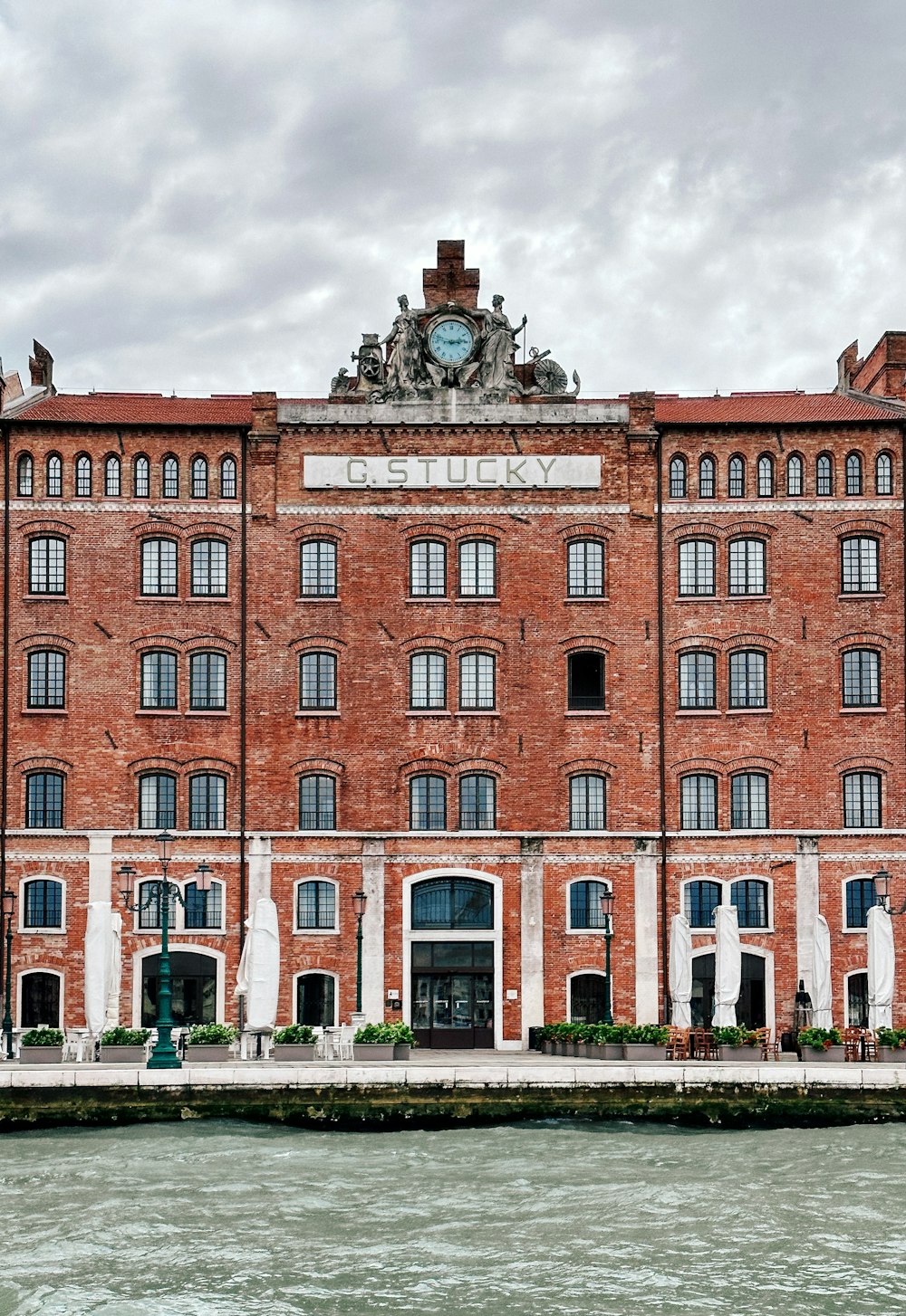 a large brick building with a clock on top of it