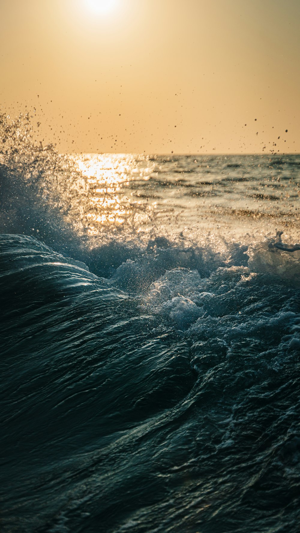 a person riding a surfboard on a wave in the ocean