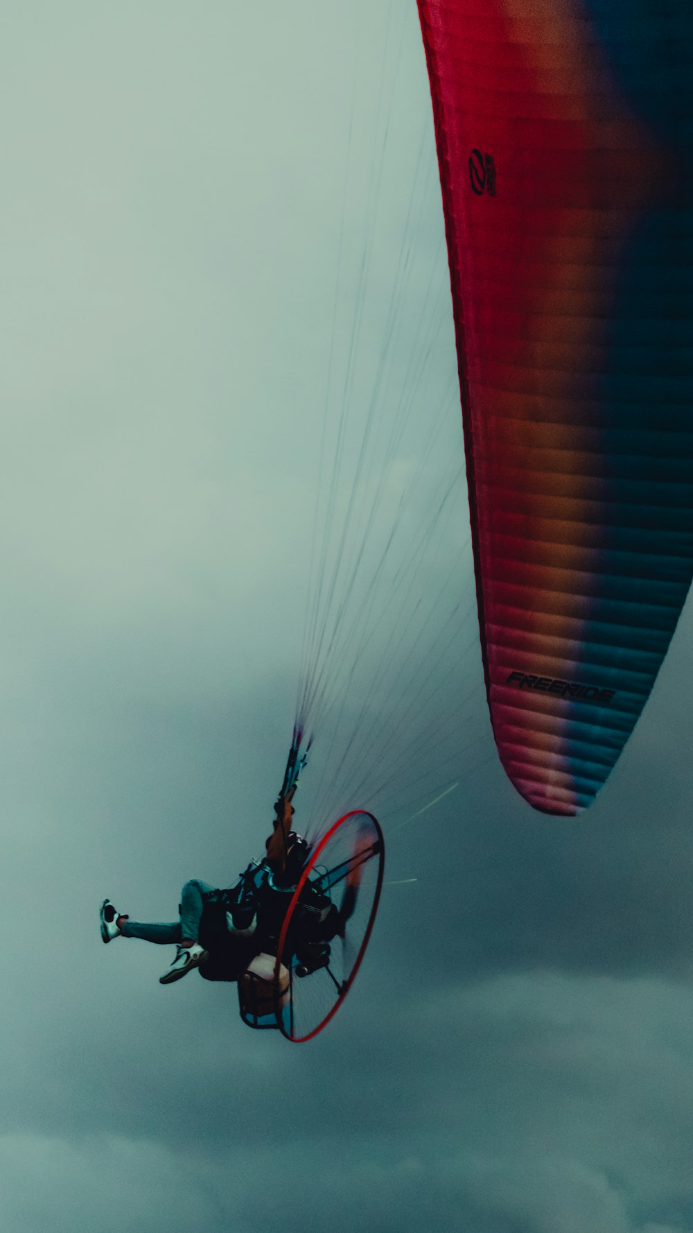 a person is parasailing on a cloudy day