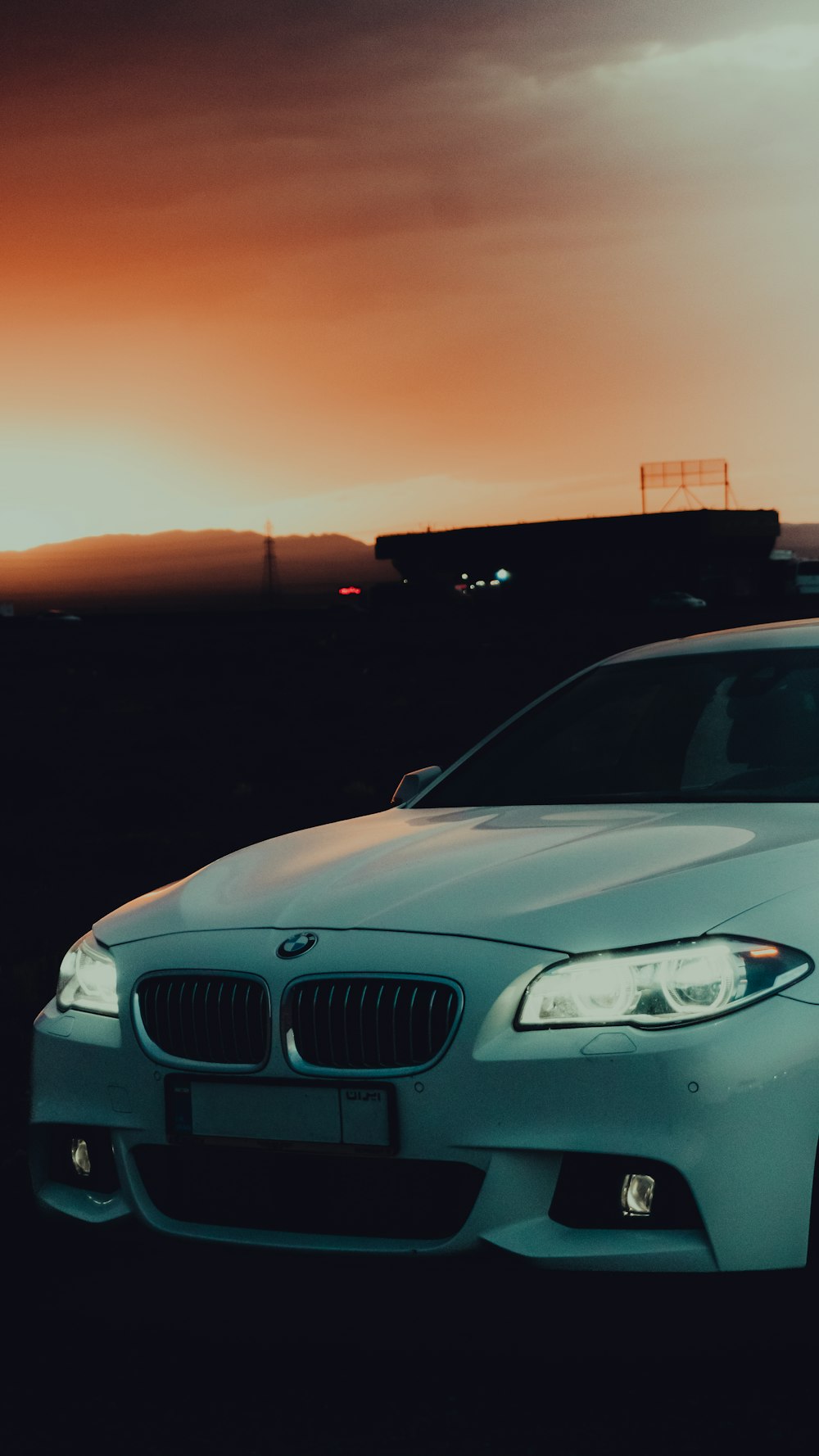 a white car parked in a parking lot