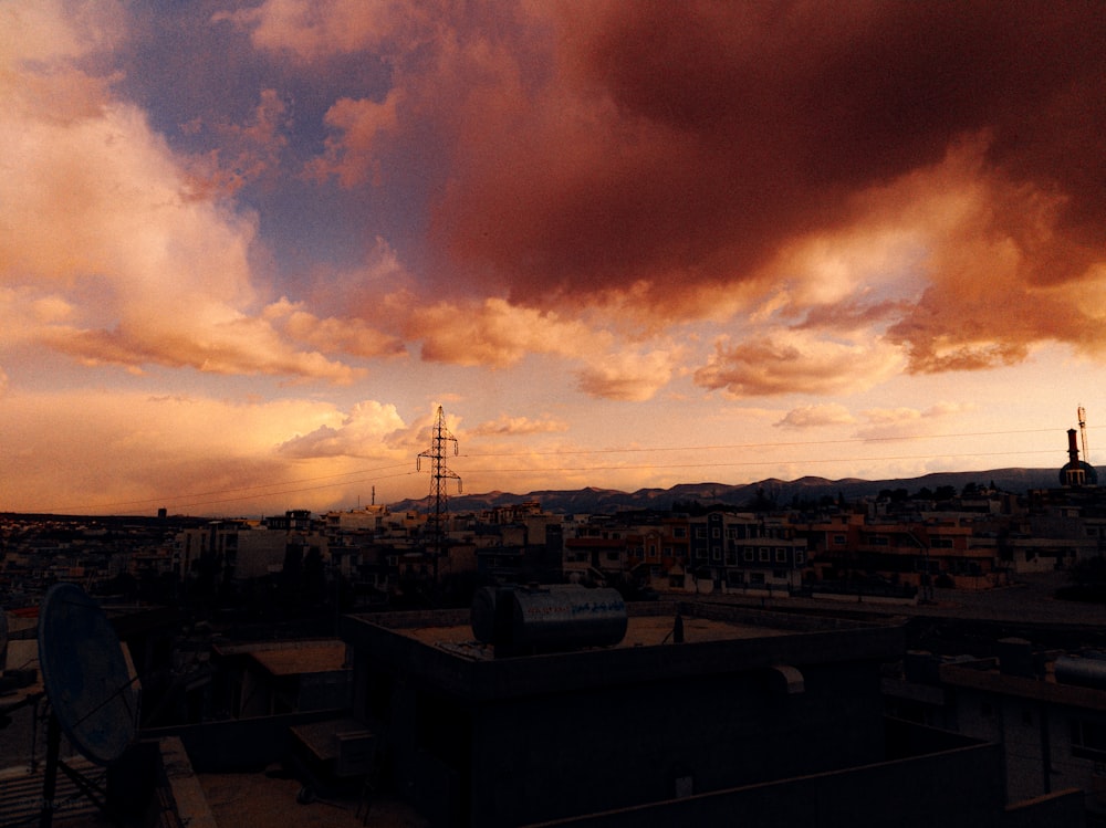 a sunset view of a city with a red sky