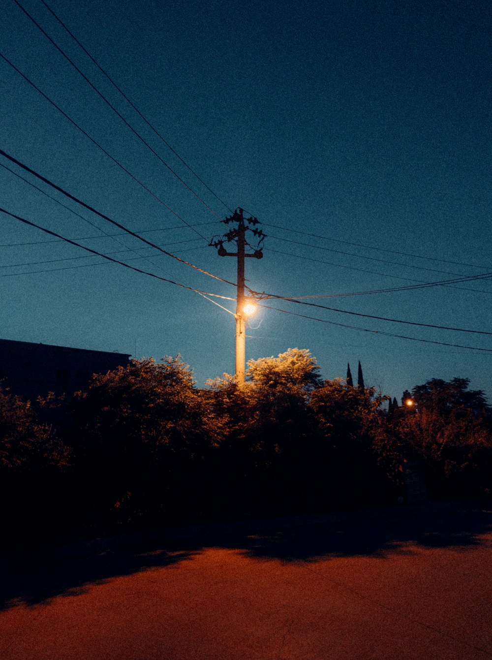 a street light on a pole in the dark