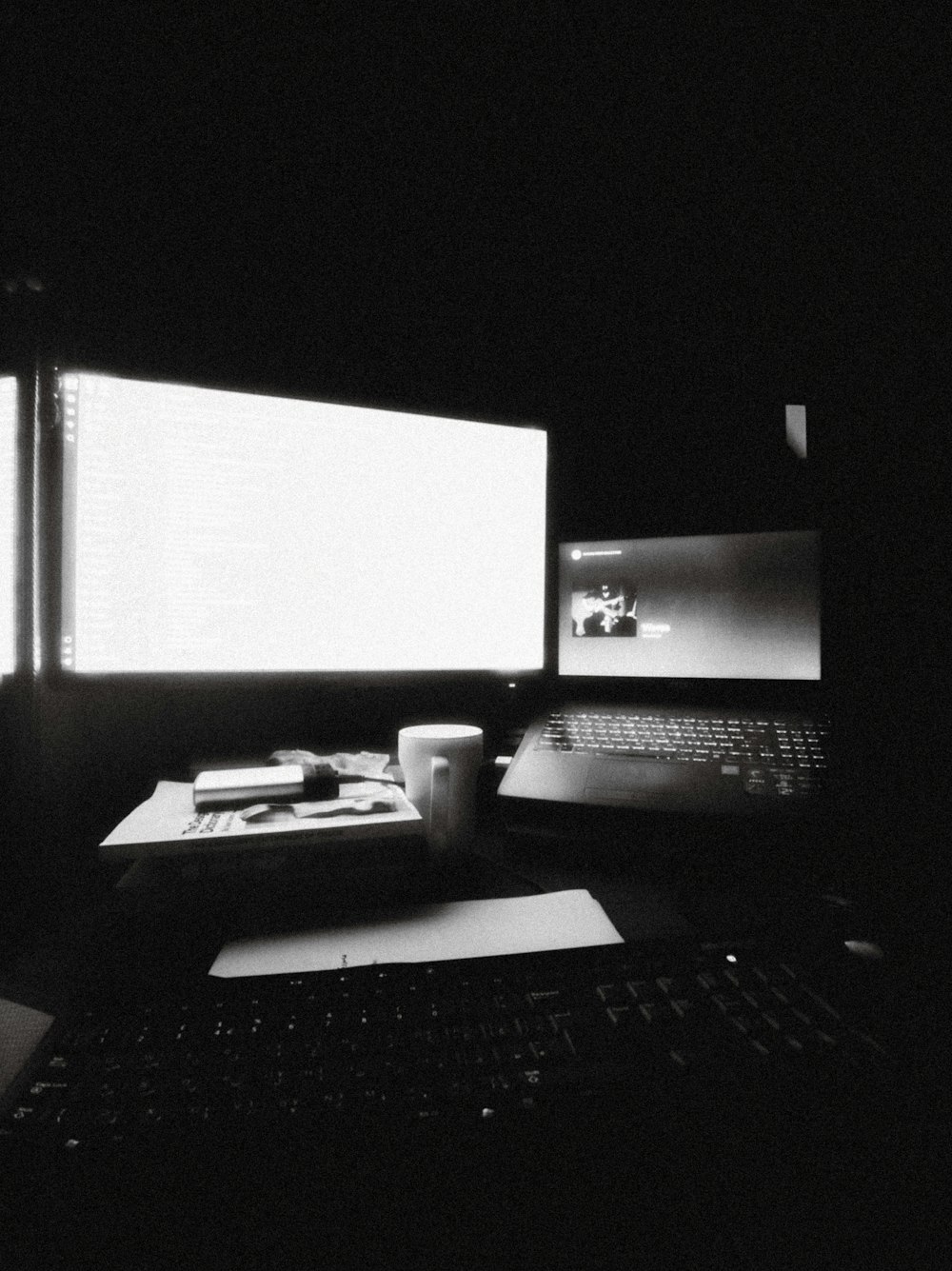 a laptop computer sitting on top of a desk