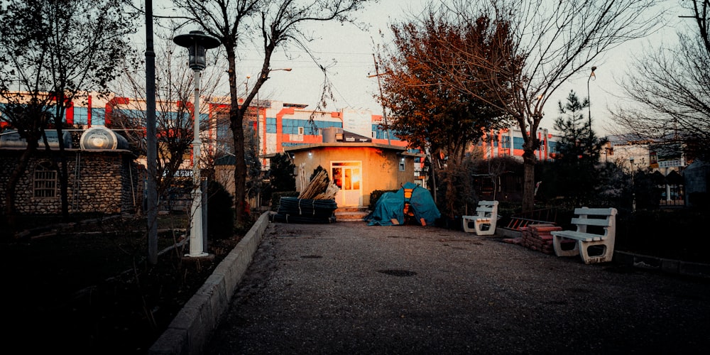 a group of white chairs sitting in front of a building