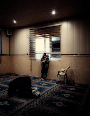 A warm, inviting room where a counselor listens attentively to a person seeking spiritual guidance.