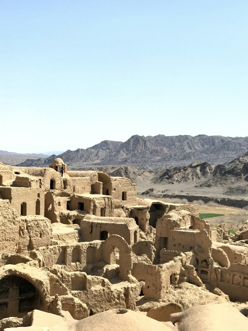 a view of a village in the middle of the desert