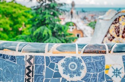Close-up of elegant ceramic tiles being installed in an outdoor seating area.