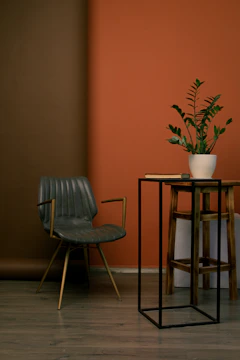 Cozy corner with a premium armchair and minimalist side table in natural wood.