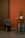 Close-up of elegant metal furniture corner with gold accents in a minimalist room.