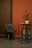 Close-up of elegant metal furniture corner with gold accents in a minimalist room.