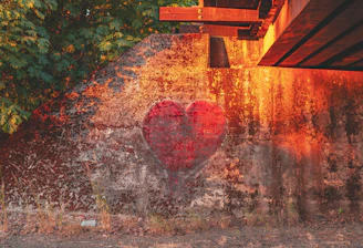 a heart painted on the side of a building