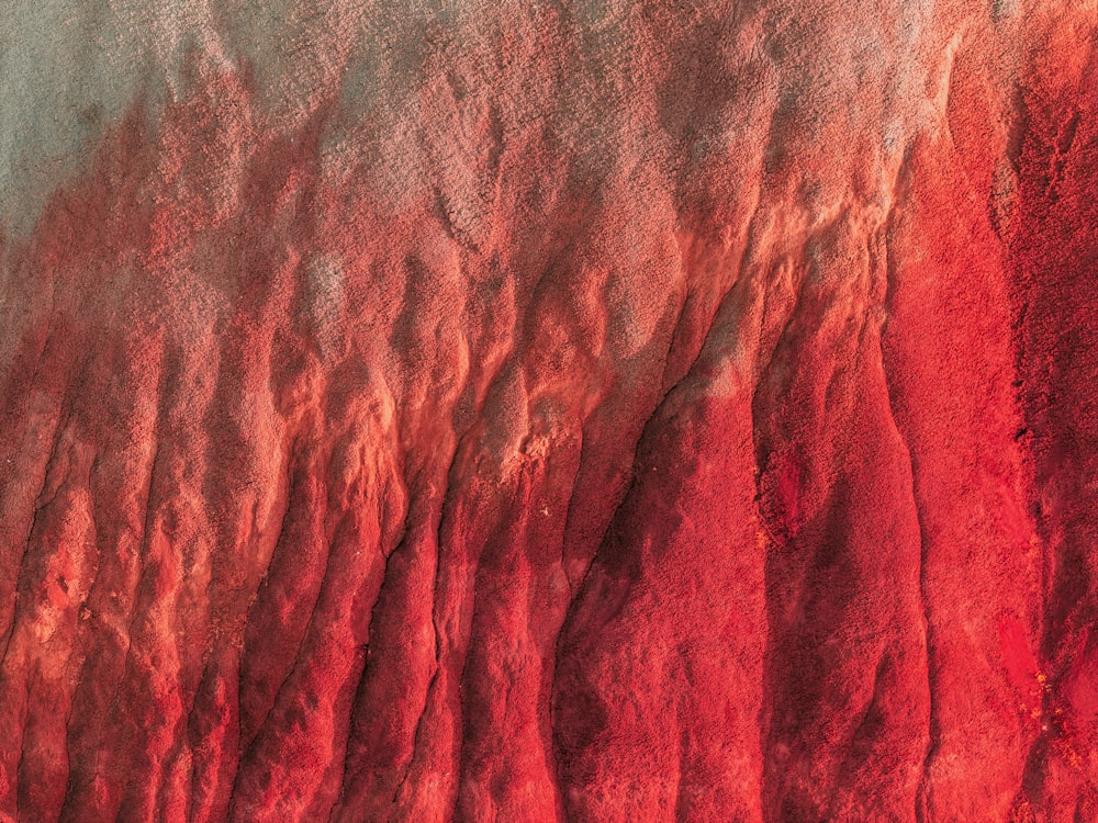 a close up of a red and white substance