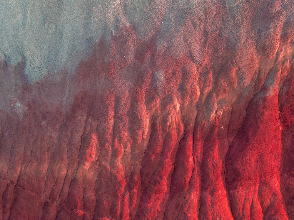 an aerial view of a red and green landscape