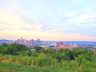 A panoramic view of the Philadelphia skyline at sunset, with banners for the CDC-USA National Convention 2026 fluttering in the foreground.