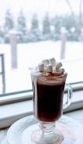 a cup of hot chocolate with marshmallows on top