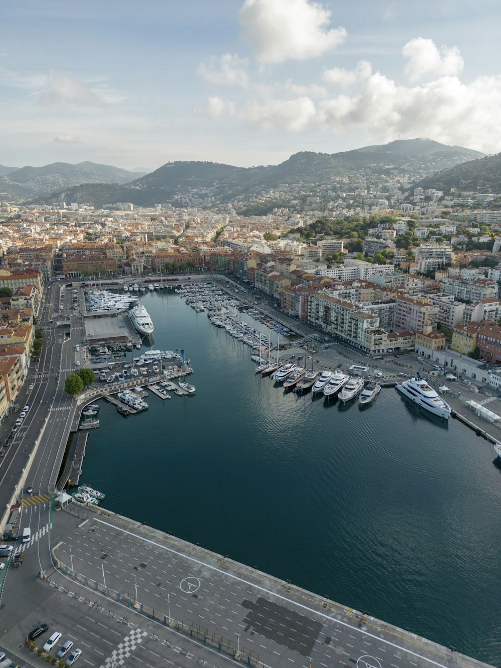 an aerial view of a marina with boats in the water