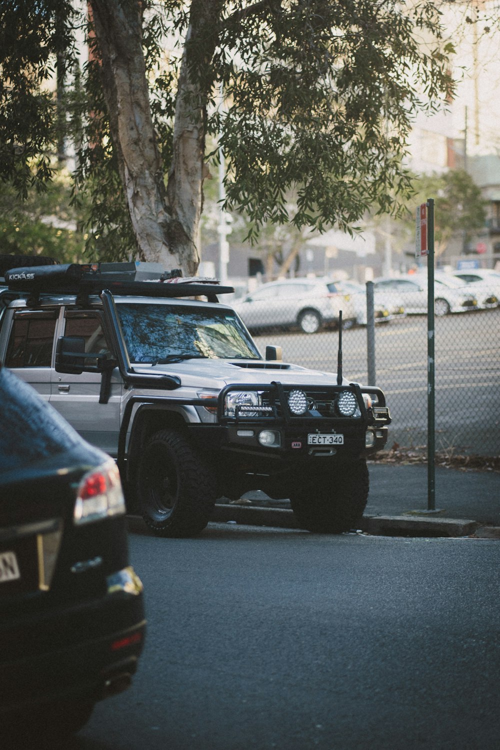 a jeep is parked on the side of the road