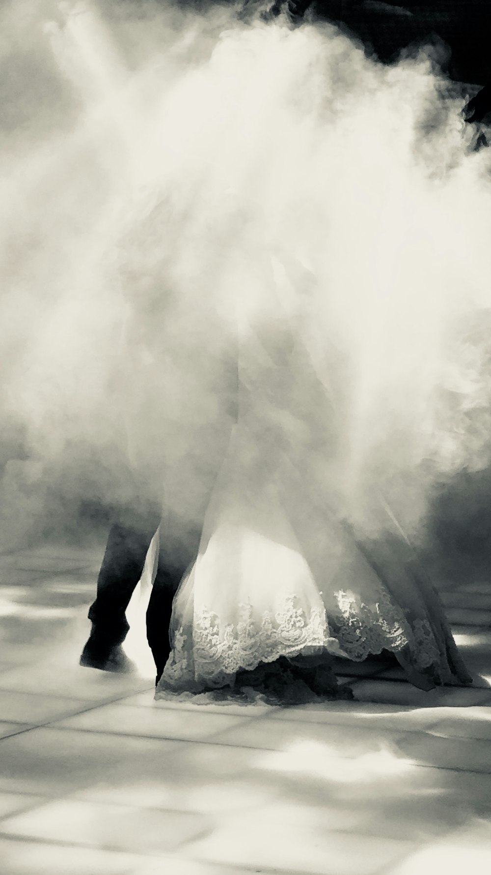 a woman in a wedding dress is covered in smoke