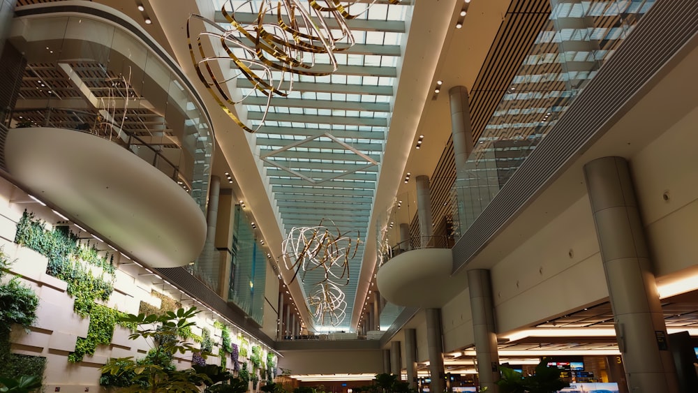 a large atrium with a chandelier hanging from the ceiling