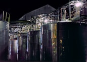 a group of large metal tanks sitting next to each other