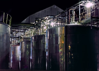 a group of large metal tanks sitting next to each other