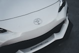 the front end of a white sports car