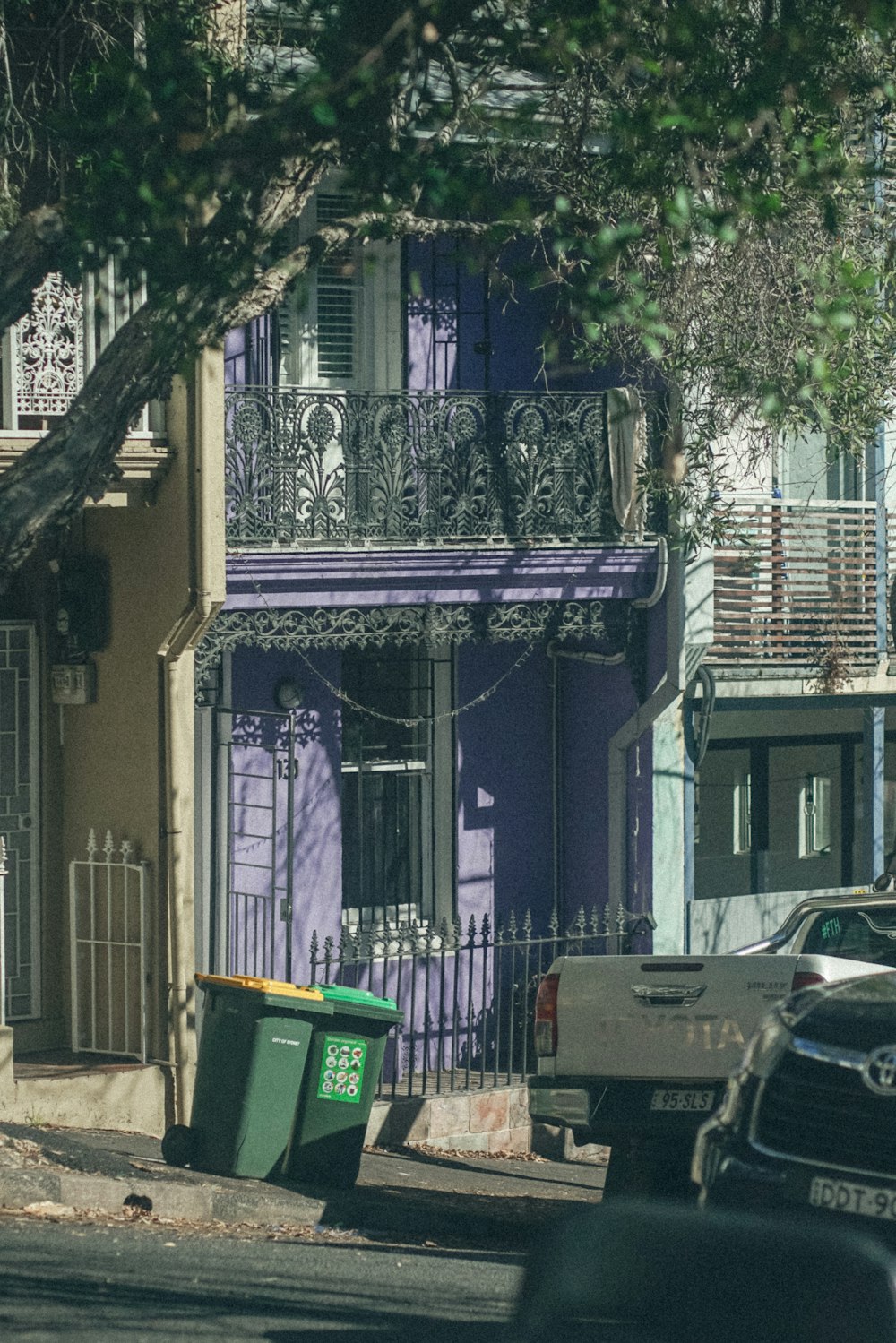 a street scene with cars parked on the side of the road