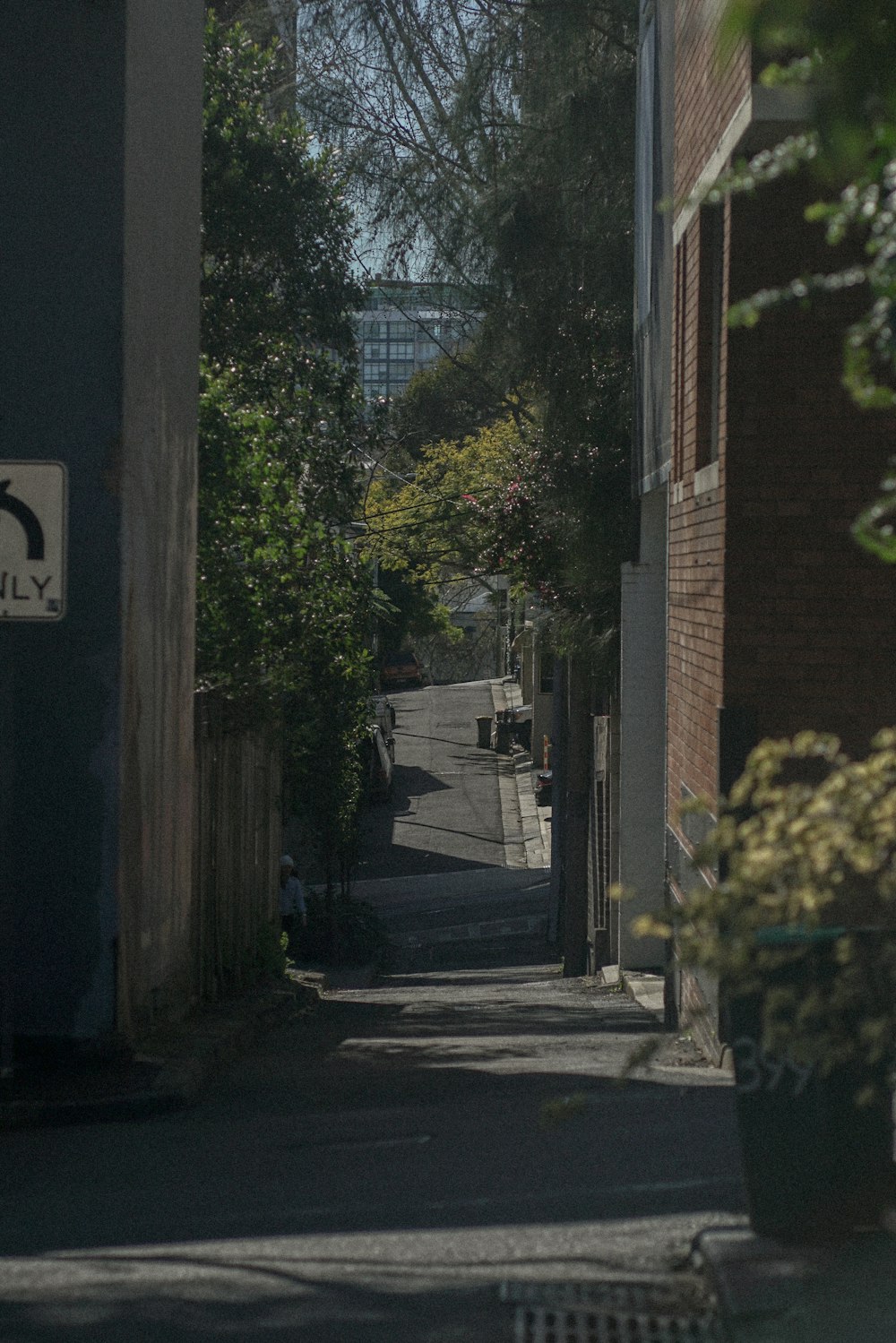 a narrow street with a no parking sign on it