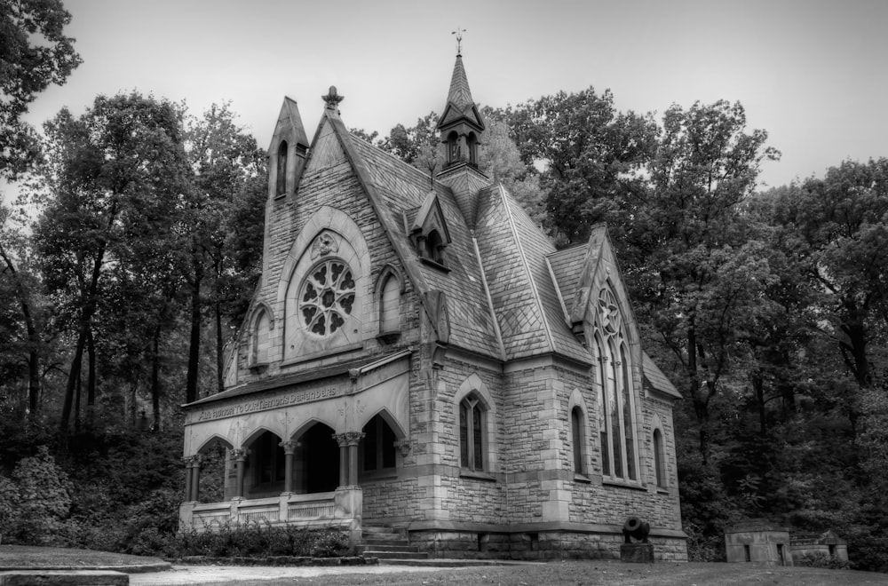 a black and white photo of an old church