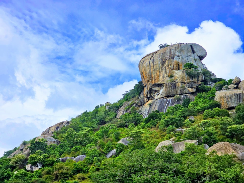 a mountain with a large rock face on top of it