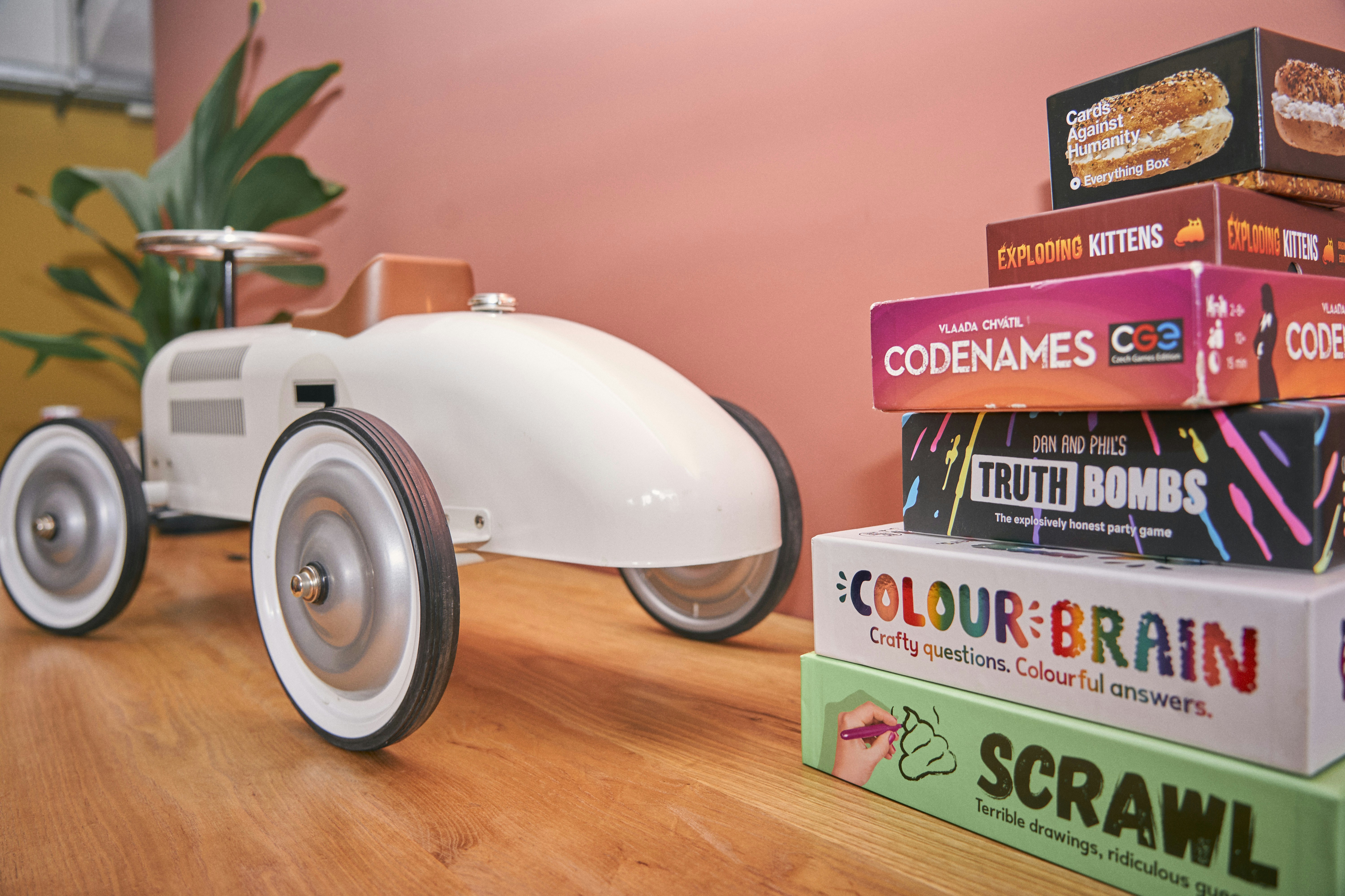 a toy car sitting on top of a stack of books