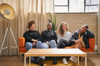 a group of people sitting on top of a couch