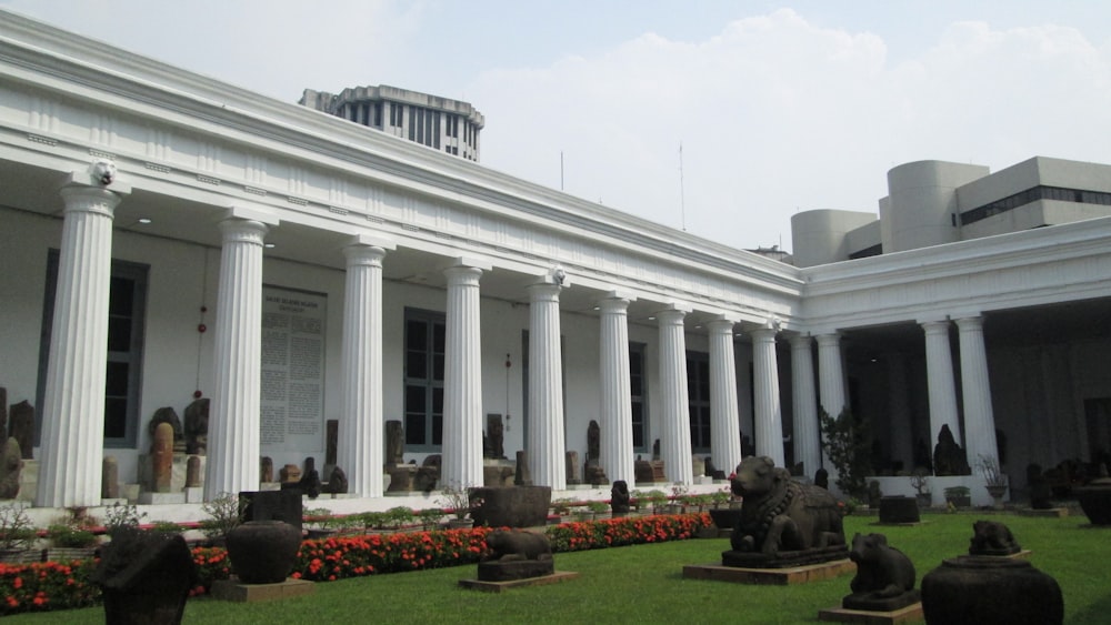 a building with columns and statues in front of it