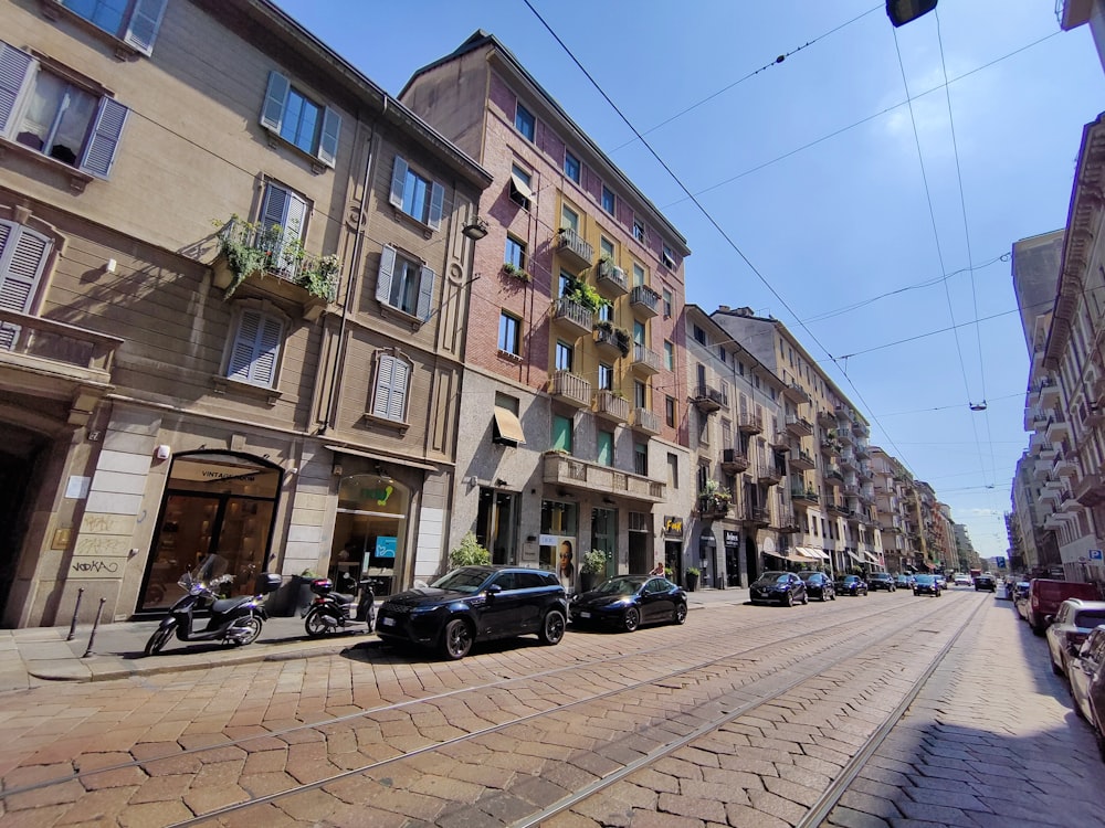 a row of cars parked on the side of a street