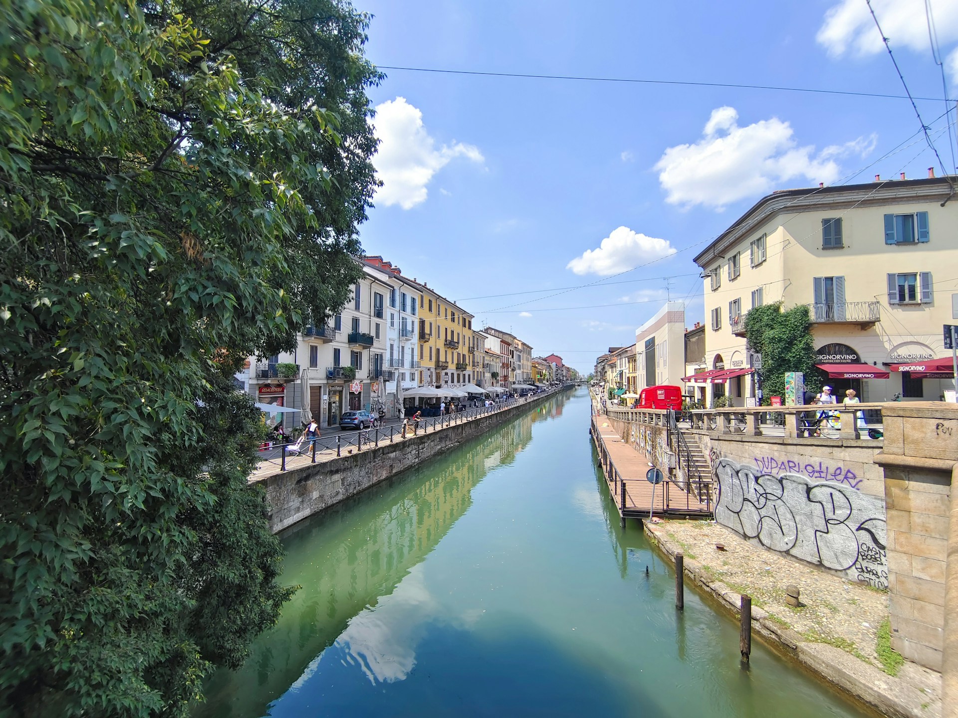a river running through a city next to tall buildings