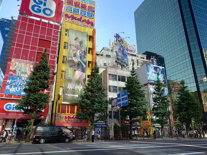 A vibrant large-format banner showcasing a colorful promotional design in a busy urban street.