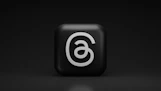 a black square with a white number six on it
