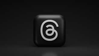 a black square with a white number six on it