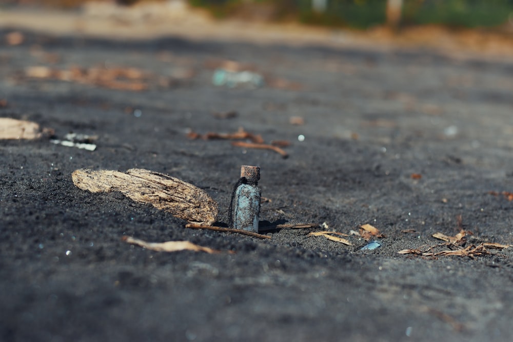 a broken bottle sitting in the middle of a road